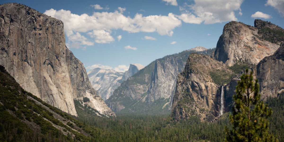 Yosemite Valley from Tunnel View: El Capitan, Half Dome, and Bridalveil Fall under clouds